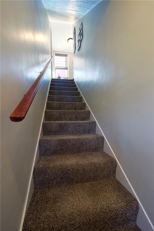 1718 Rte 481 Charleroi, PA 15022 - Photo 15 of 24 CARPETED STAIRS WITH FULL LENGTH HAND RAIL TO SECOND FLOOR