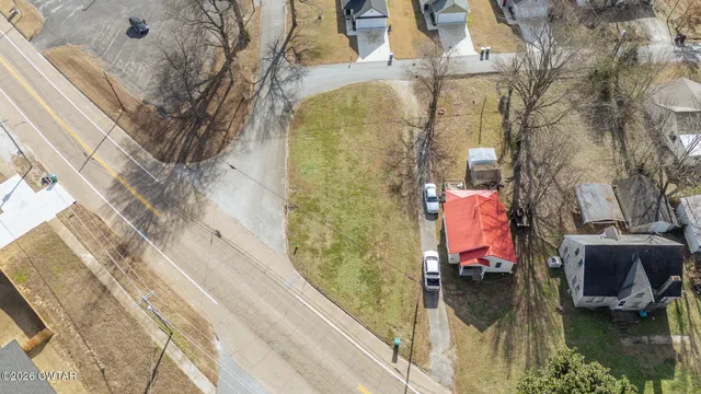 an aerial view of residential house with outdoor space
