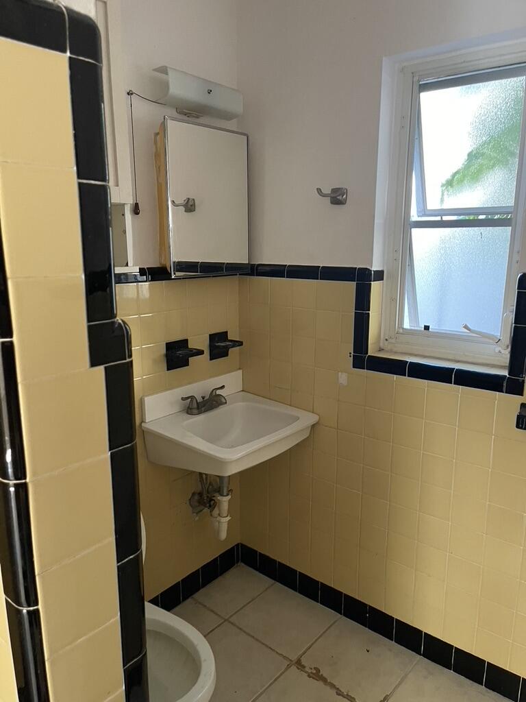 115 East Lantana Road, Unit 2 Lantana, FL 33462 - Photo 6 of 7 a bathroom with a sink and a mirror