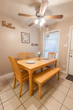 a dining room with a table and chairs