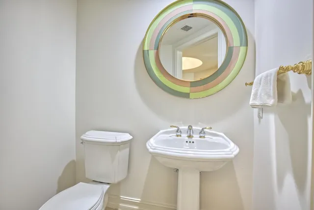 a bathroom with a toilet and a sink