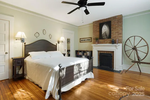 a bed room with a bed and a fireplace