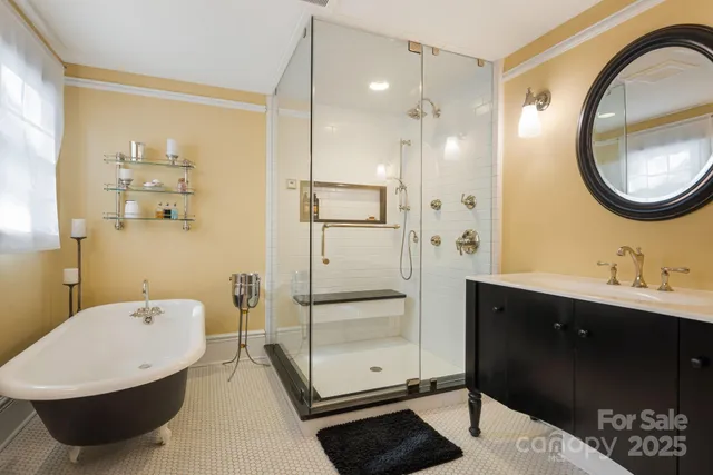 a bathroom with a tub sink and mirror
