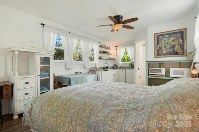 a large white bed in a bedroom