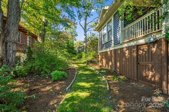a backyard of a house with lots of green space