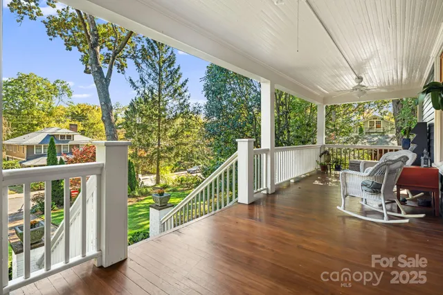 a view of a porch with furniture and garden