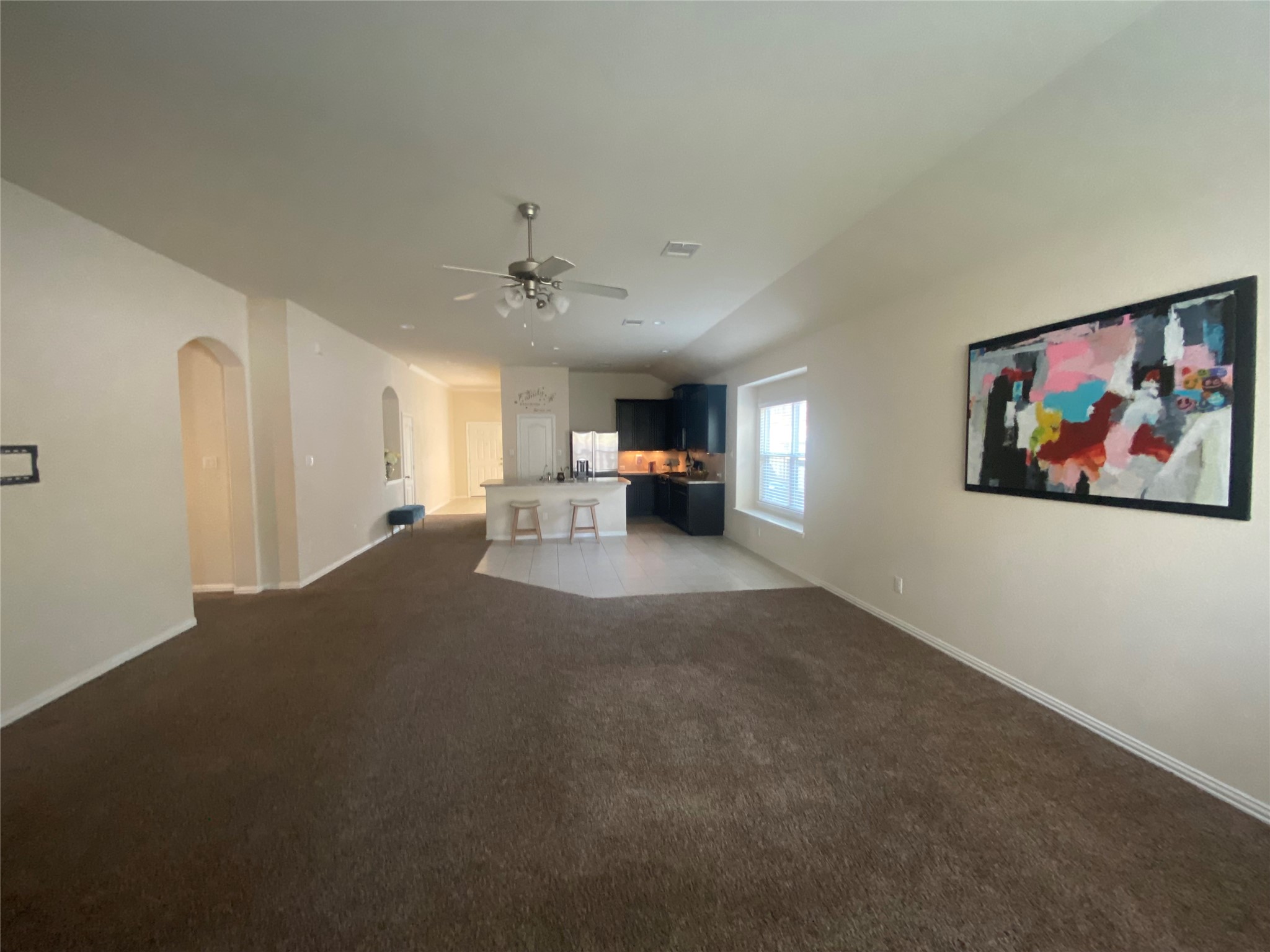22810 Highland Bluff Lane Spring, TX 77373 - Photo 6 of 11 View of the kitchen and dining room from the end of the living room