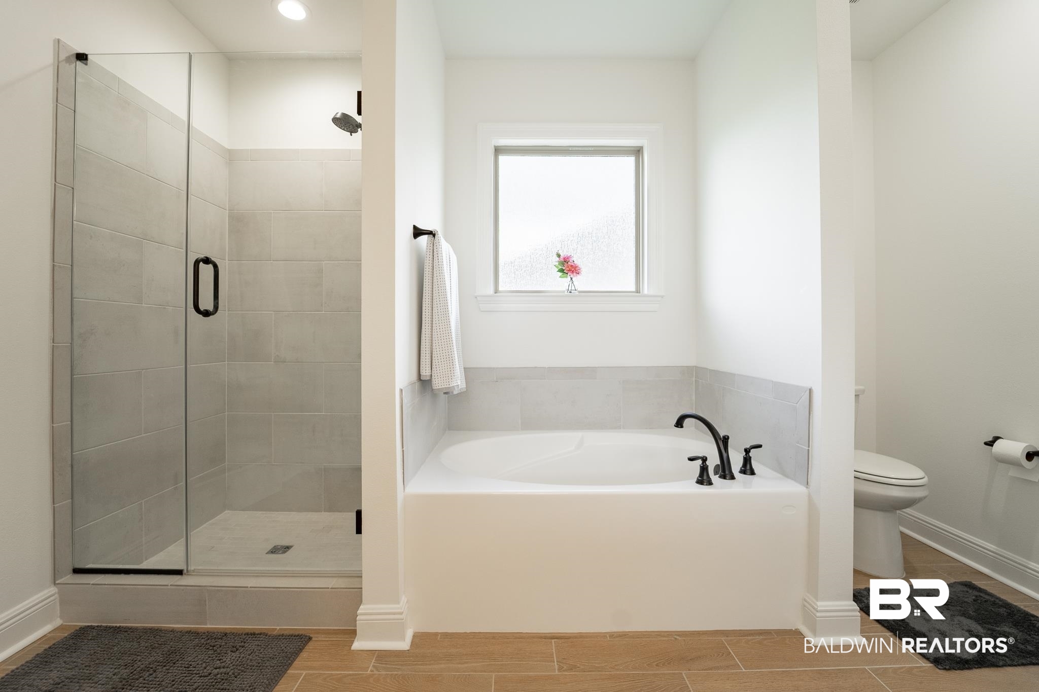 896 Sumter Loop Foley, AL 36535 - Photo 14 of 23 Bathroom with hardwood / wood-style floors, toilet, and independent shower and bath