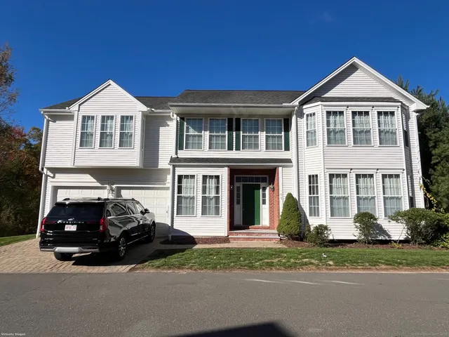 a car parked in front of a house