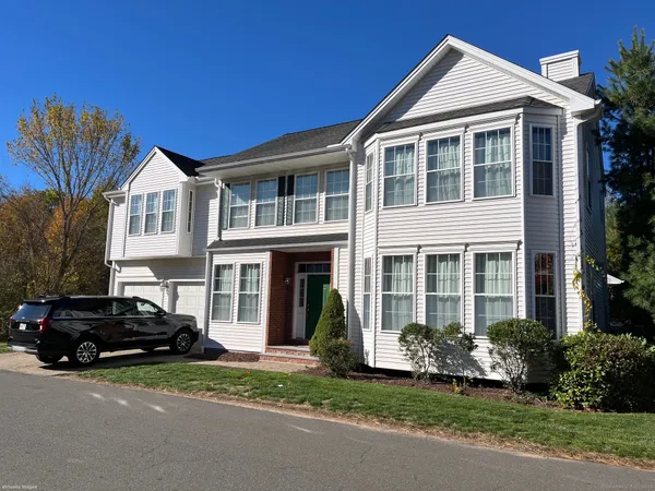 a front view of a house with a yard