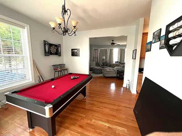 a room with pool table and flat screen tv