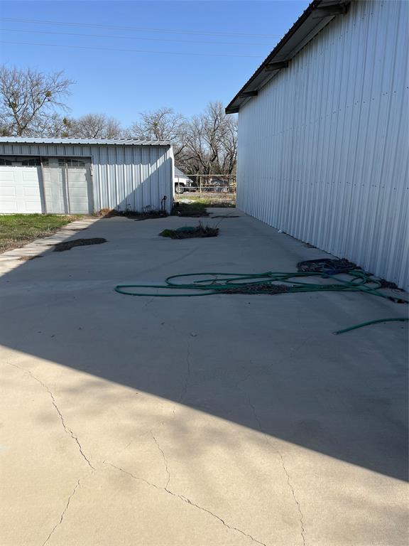 60 Cobler Road Collinsville, TX 76233 - Photo 13 of 17 RV parking pad with water and sewer connections