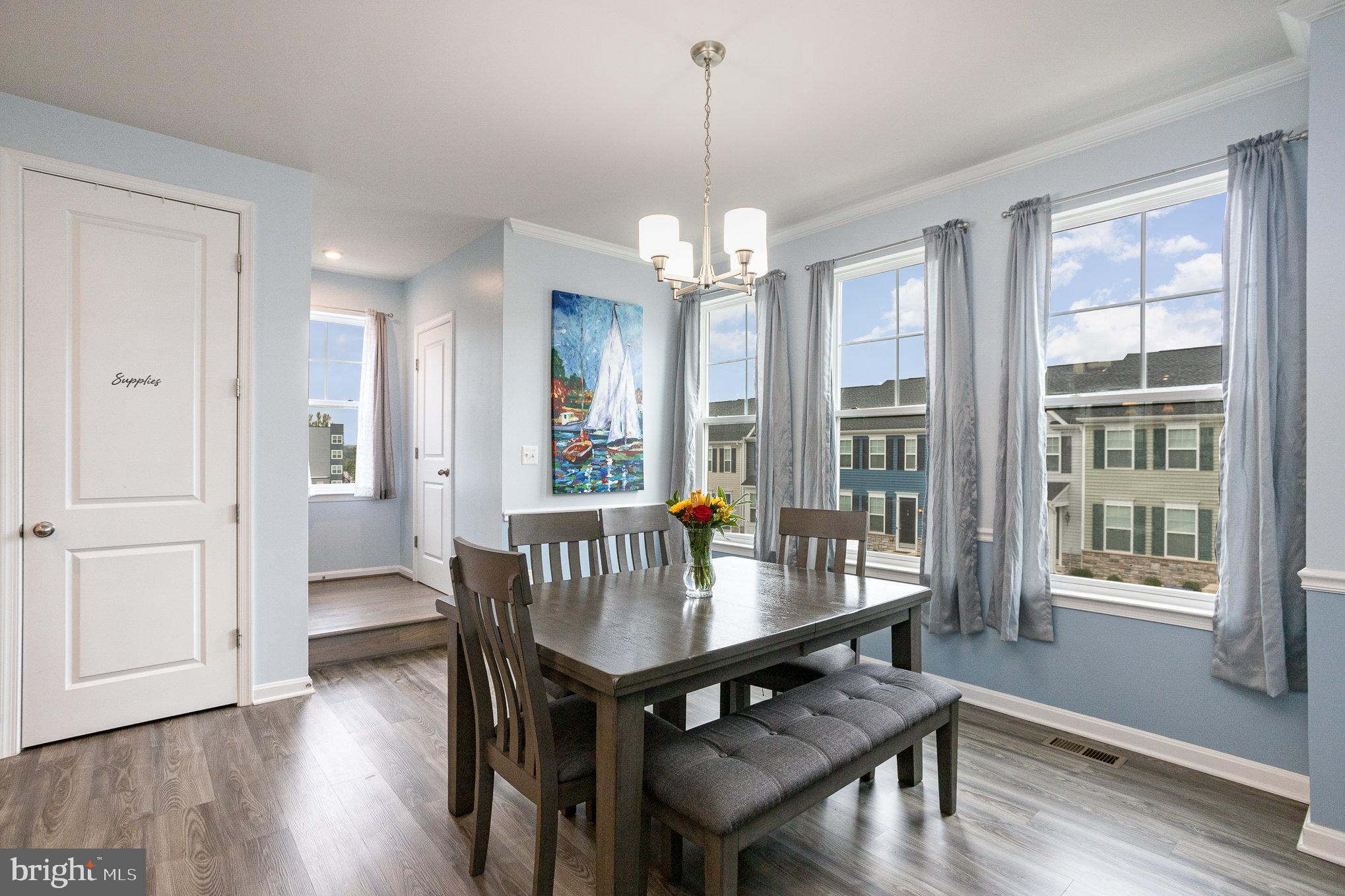 18236 Summit Pointe Drive Triangle, VA 22172 - Photo 11 of 36 a view of a dining room with furniture window and wooden floor