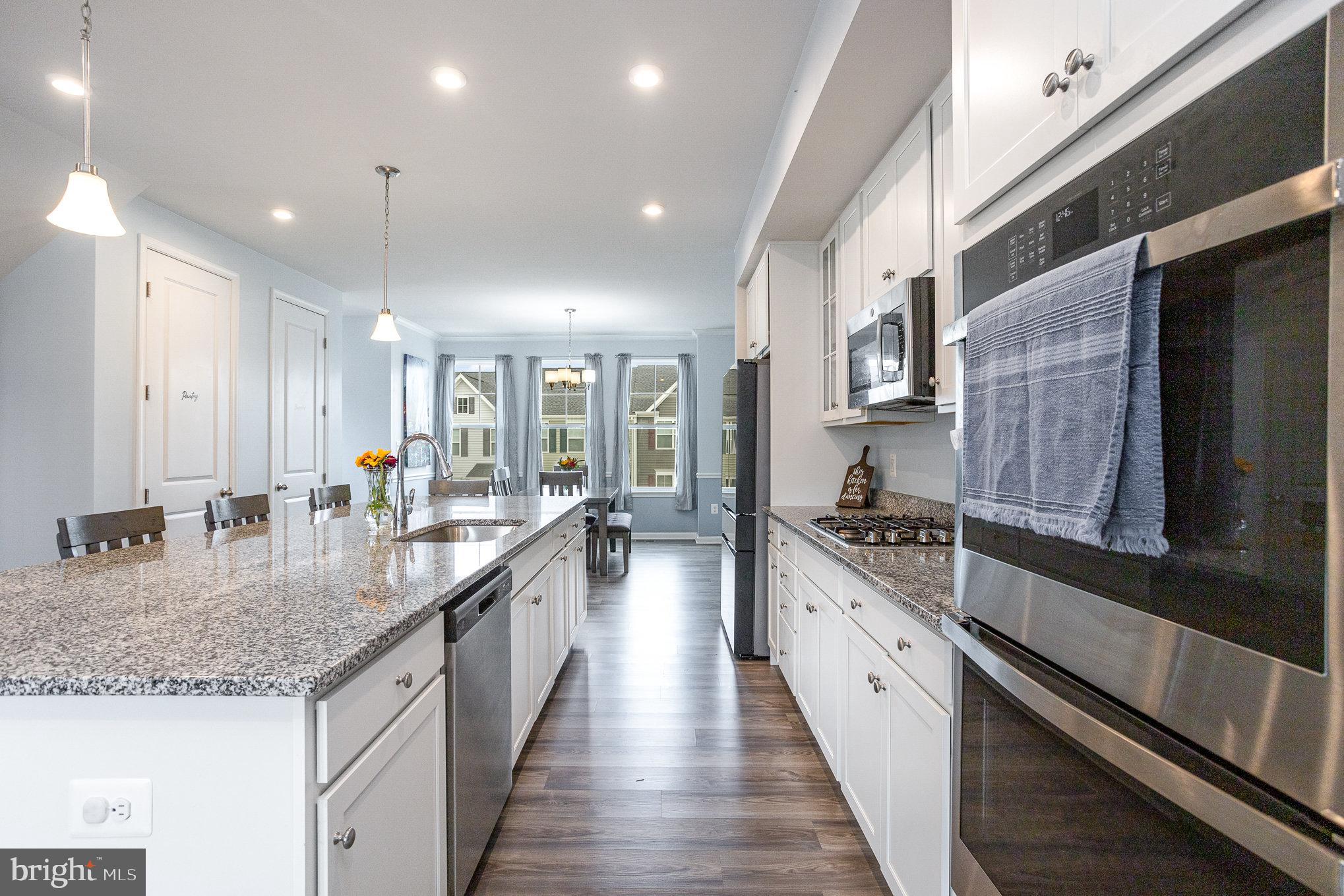 18236 Summit Pointe Drive Triangle, VA 22172 - Photo 17 of 36 a large kitchen with granite countertop lots of counter space and a sink