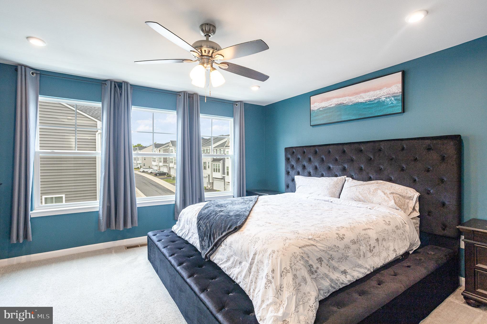 18236 Summit Pointe Drive Triangle, VA 22172 - Photo 22 of 36 a bed sitting in a bedroom next to a window