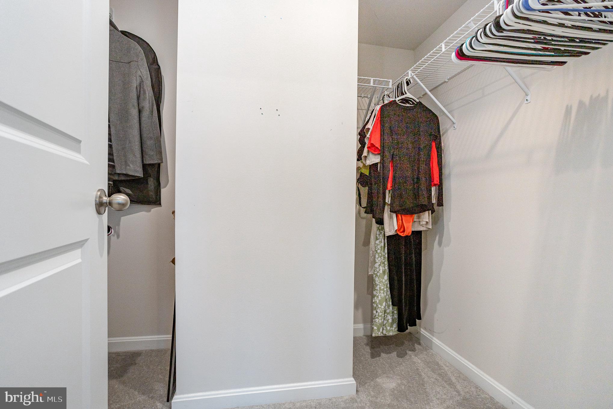 18236 Summit Pointe Drive Triangle, VA 22172 - Photo 24 of 36 a view of walk in closet with clothes