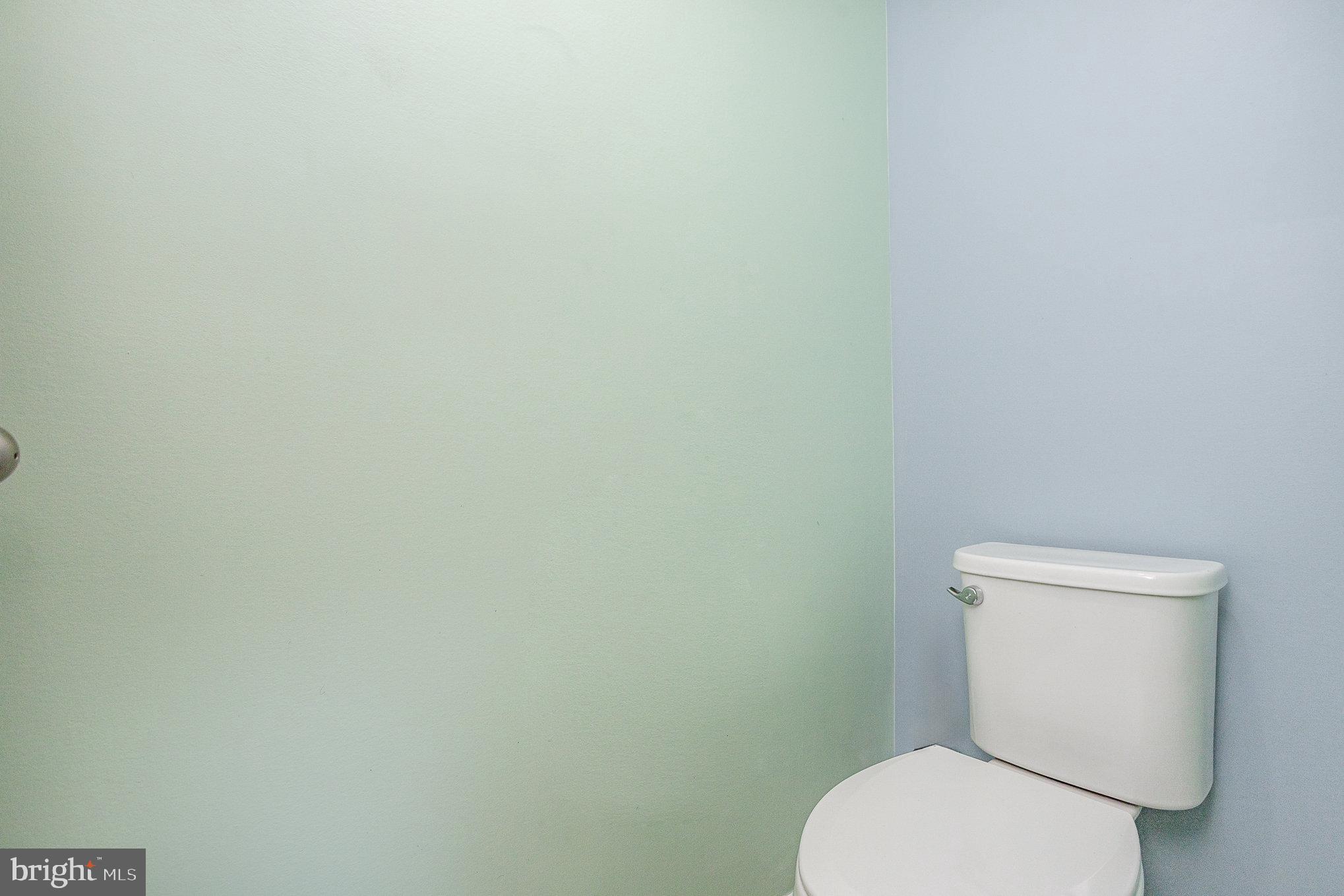 18236 Summit Pointe Drive Triangle, VA 22172 - Photo 26 of 36 a white toilet sitting next to a white wall