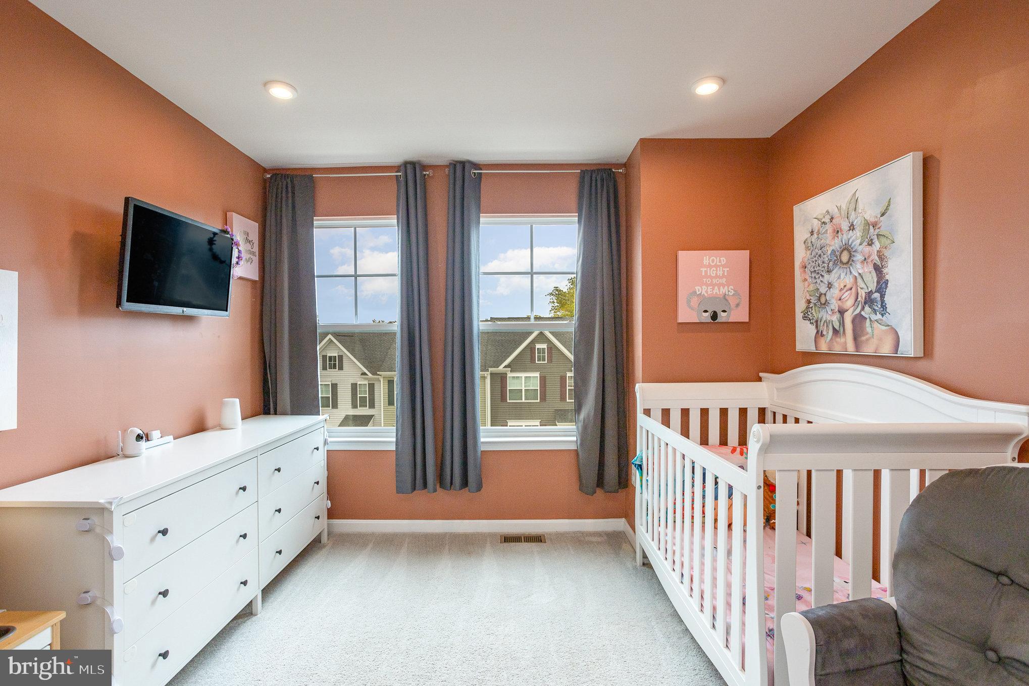 18236 Summit Pointe Drive Triangle, VA 22172 - Photo 29 of 36 a view of a livingroom with furniture and a flat screen tv