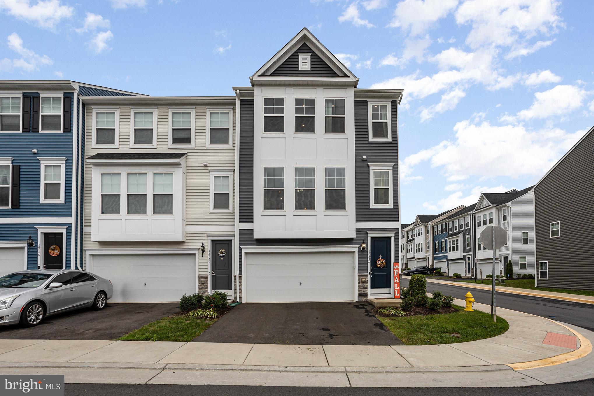 18236 Summit Pointe Drive Triangle, VA 22172 - Photo 3 of 36 a front view of a house with a yard