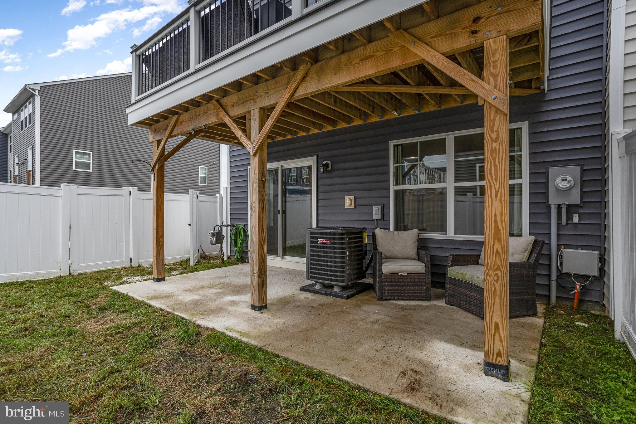 18236 Summit Pointe Drive Triangle, VA 22172 - Photo 35 of 36 a view of backyard with chair and glass door
