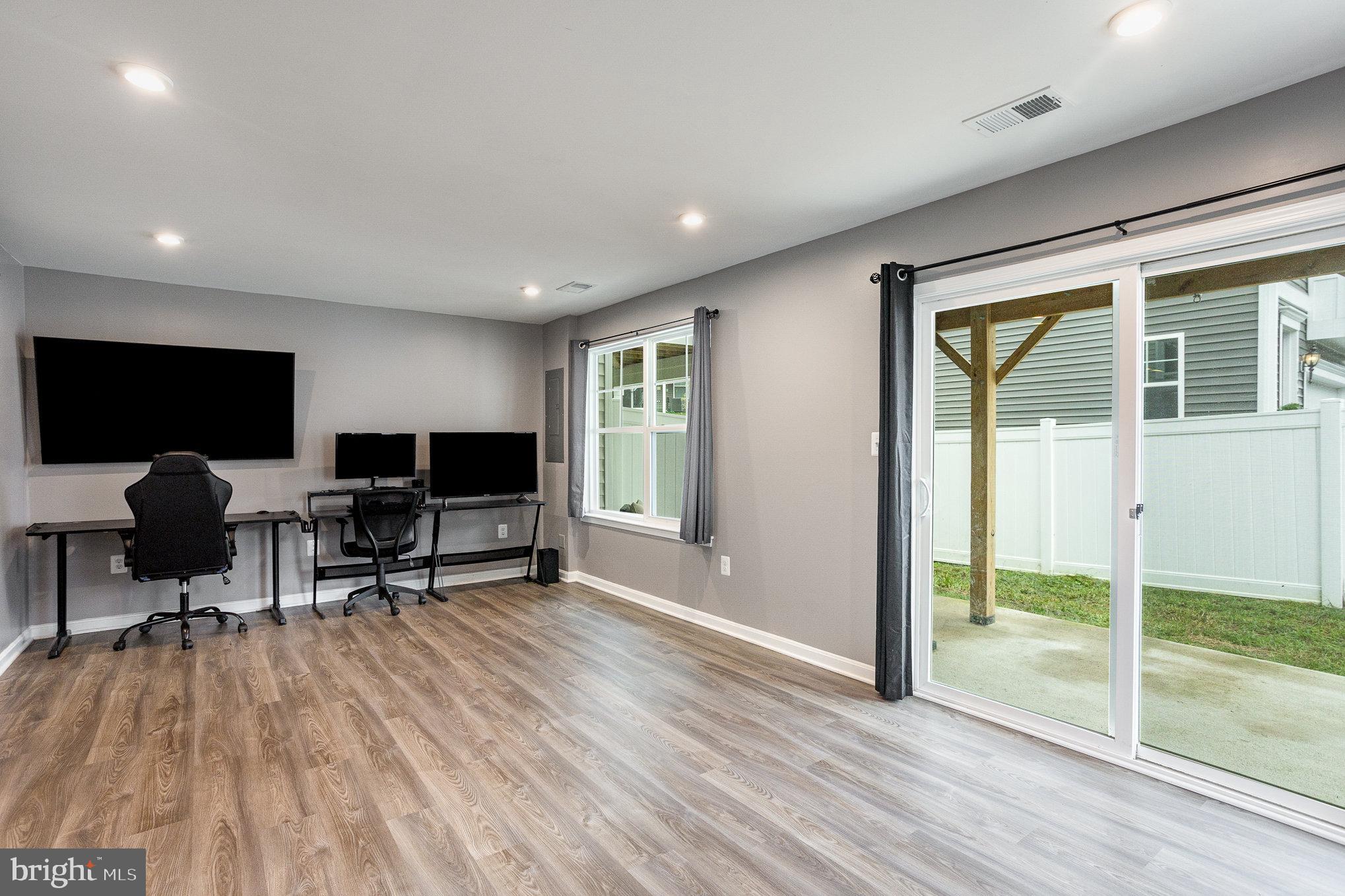 18236 Summit Pointe Drive Triangle, VA 22172 - Photo 5 of 36 a view of a livingroom with workspace and a window
