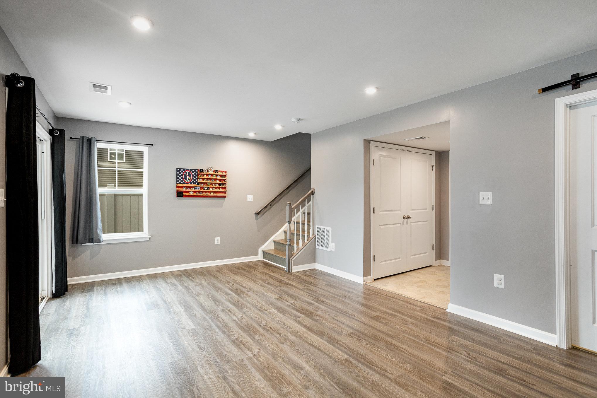 18236 Summit Pointe Drive Triangle, VA 22172 - Photo 6 of 36 wooden floor in an empty room with a window