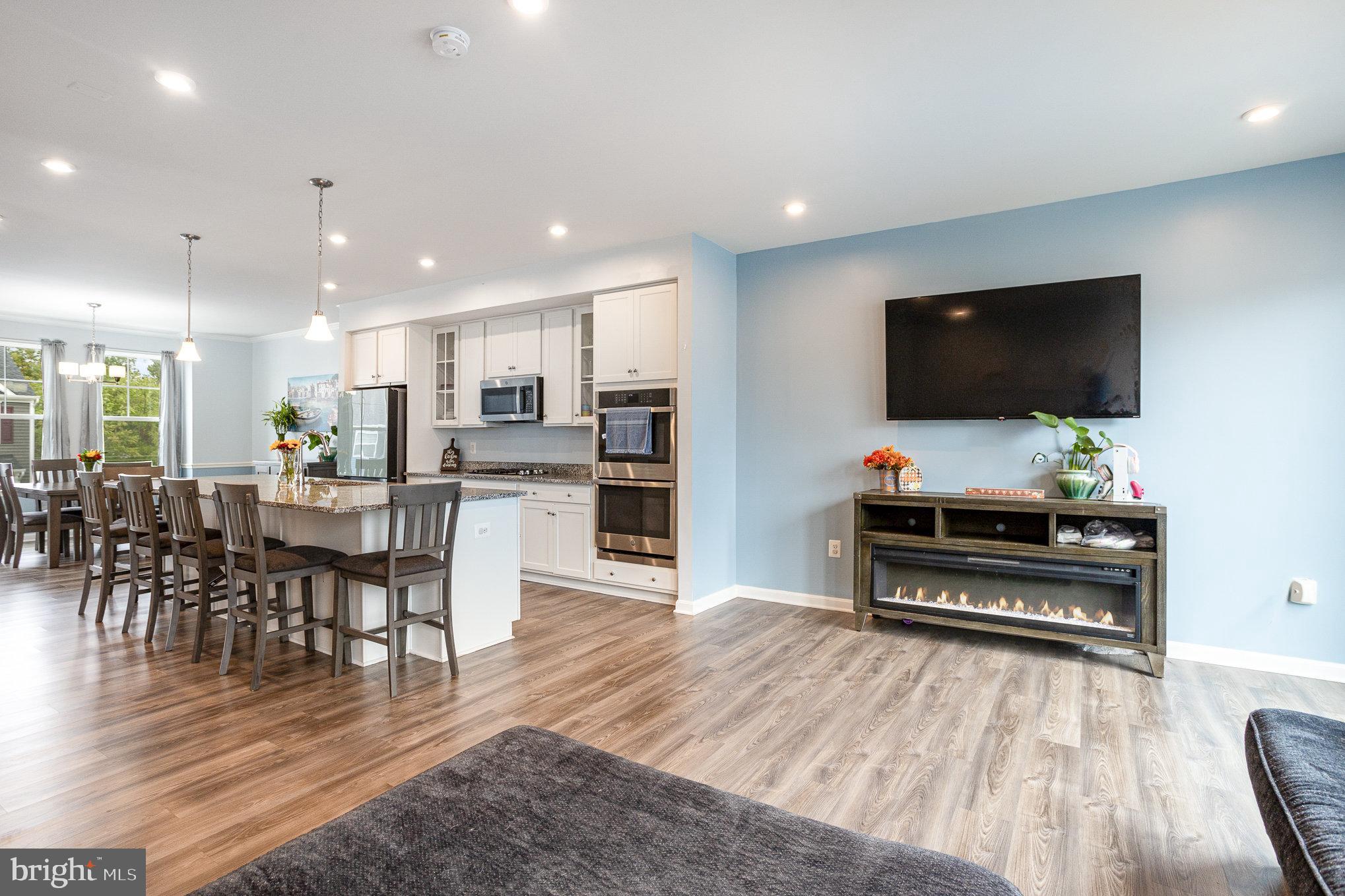 18236 Summit Pointe Drive Triangle, VA 22172 - Photo 10 of 36 a living room with furniture and a flat screen tv