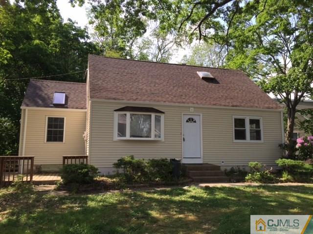 21 Channing Road East Brunswick, NJ 08816 - Photo 1 of 25 a front view of a house with garden