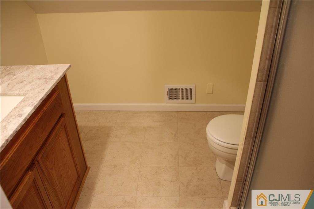 21 Channing Road East Brunswick, NJ 08816 - Photo 11 of 25 a bathroom with a sink and a vanity