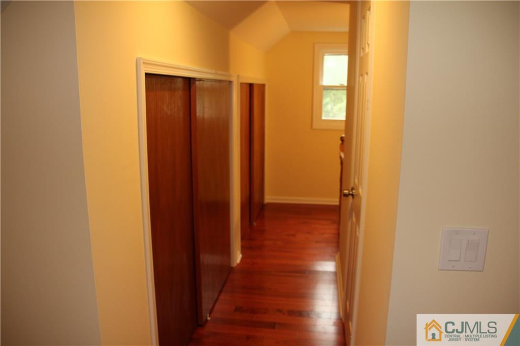 21 Channing Road East Brunswick, NJ 08816 - Photo 14 of 25 a view of hallway with wooden floor