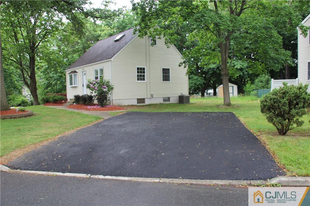 21 Channing Road East Brunswick, NJ 08816 - Photo 20 of 25 a view of a house with a yard and trees