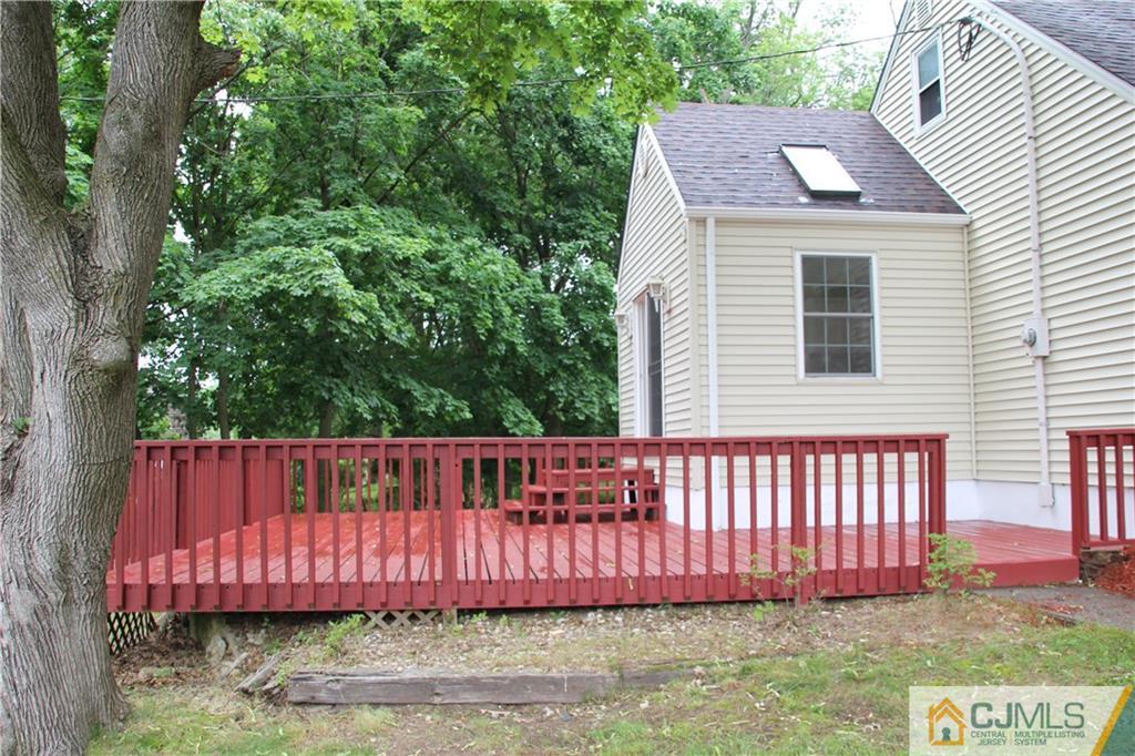 21 Channing Road East Brunswick, NJ 08816 - Photo 22 of 25 a view of a house with a wooden fence