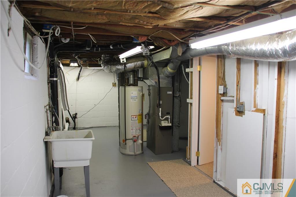 21 Channing Road East Brunswick, NJ 08816 - Photo 25 of 25 a view of walk in closet with empty shelves