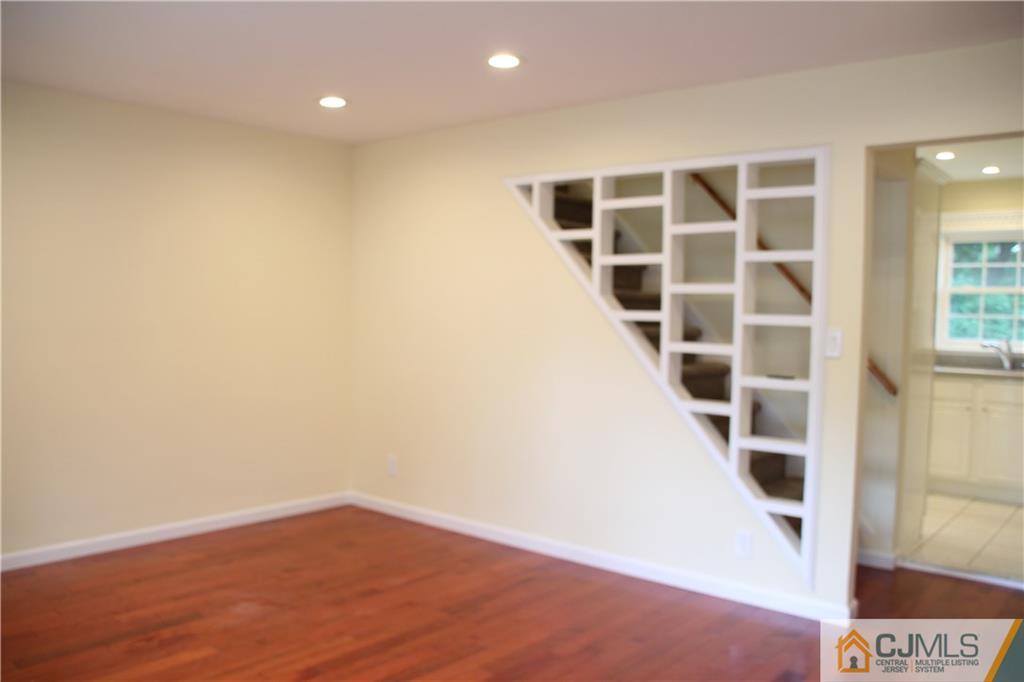 21 Channing Road East Brunswick, NJ 08816 - Photo 5 of 25 an empty room with wooden floor and windows