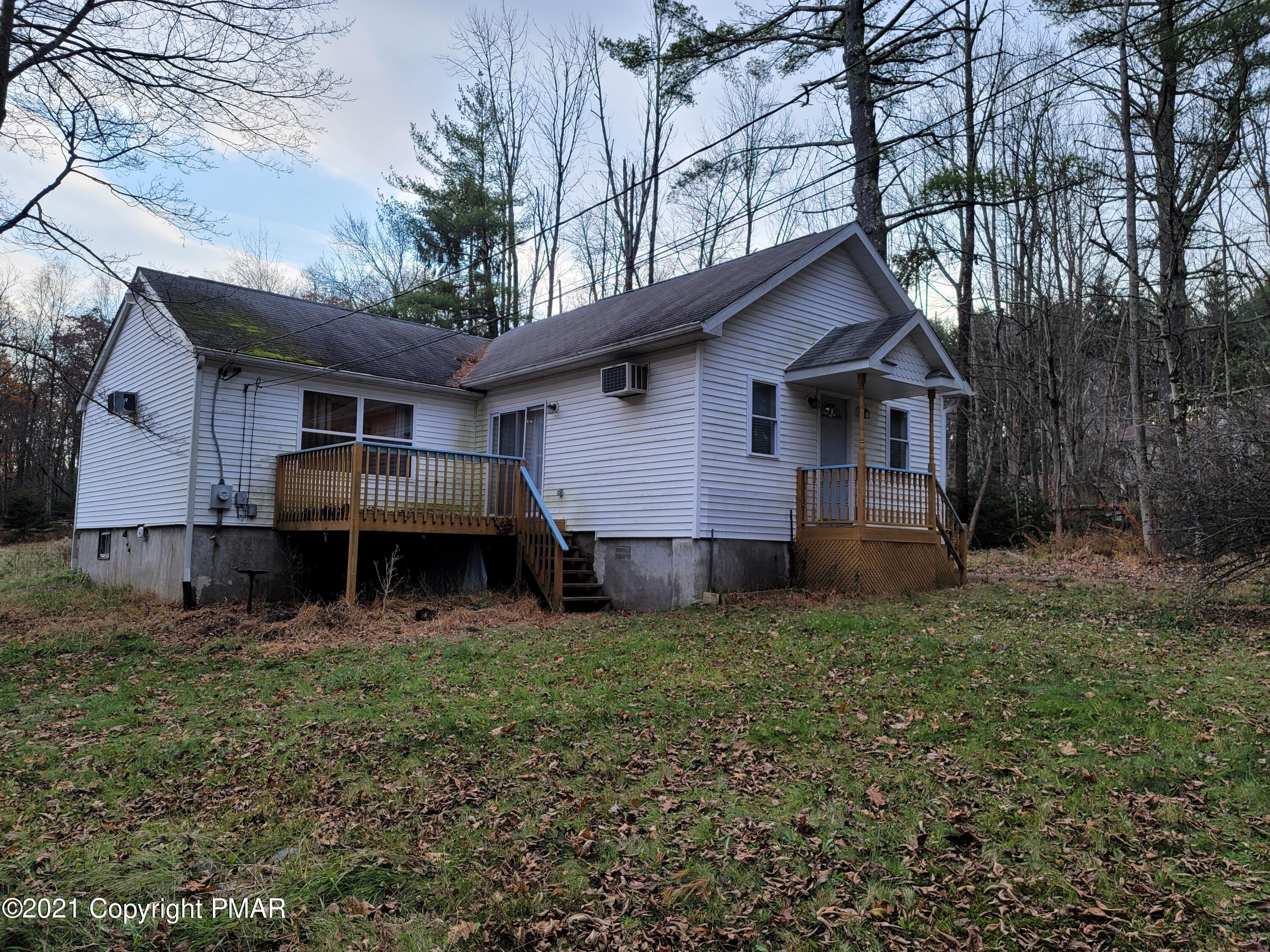 3388 Spruce Cabin Road Cresco, PA 18326 - Photo 1 of 33 a view of a house with a yard