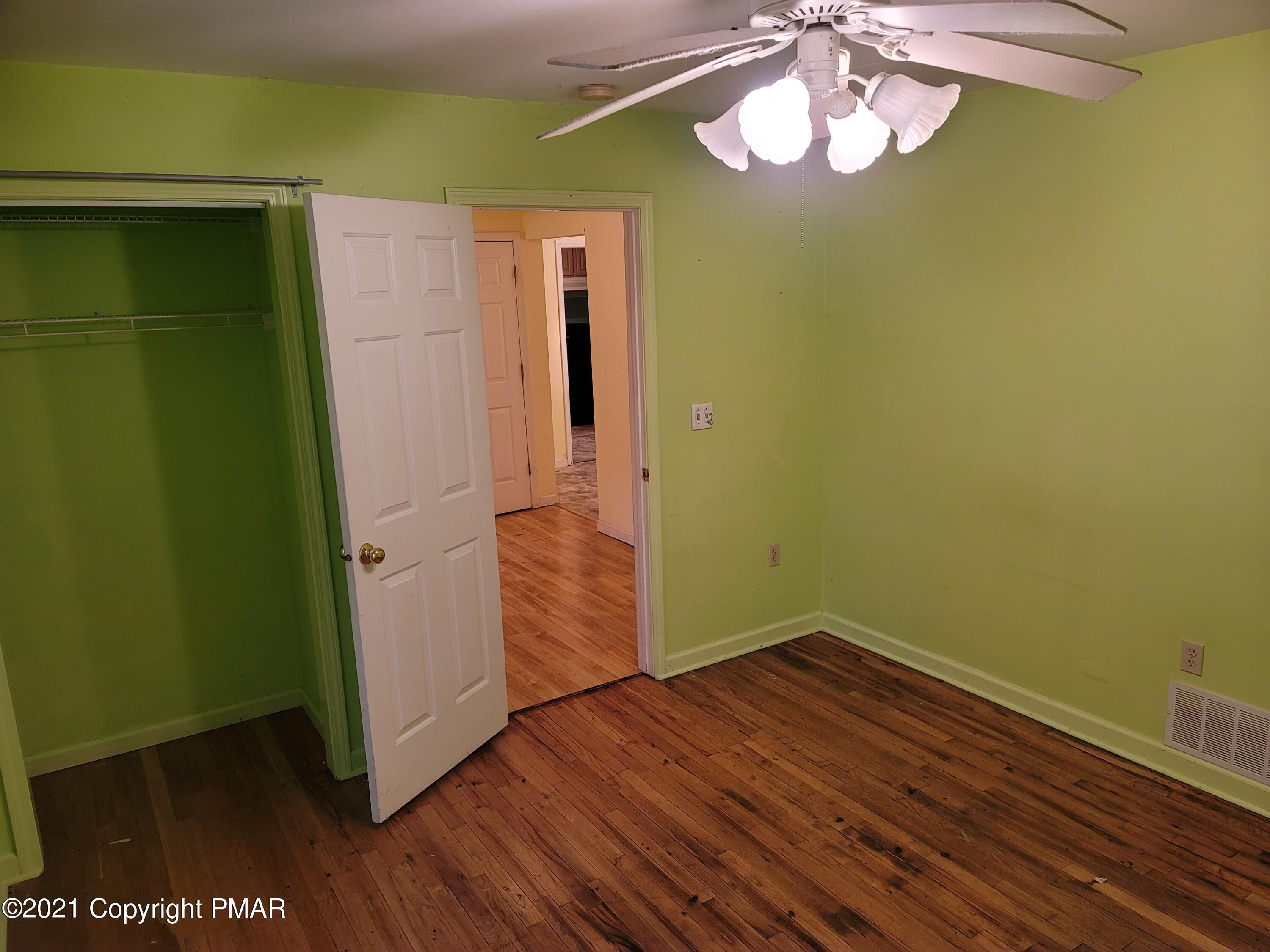 3388 Spruce Cabin Road Cresco, PA 18326 - Photo 14 of 33 wooden floor in an empty room