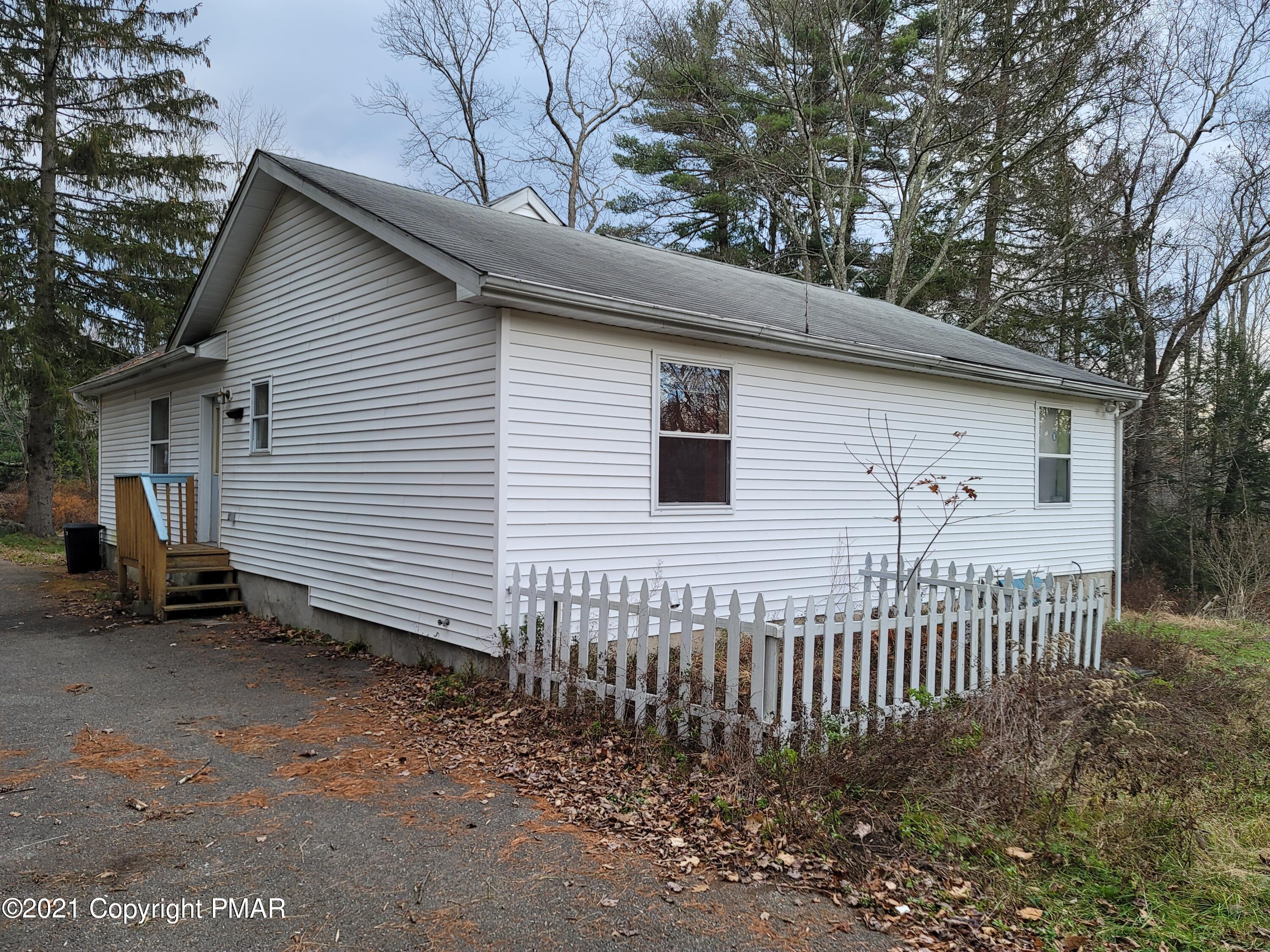3388 Spruce Cabin Road Cresco, PA 18326 - Photo 4 of 33 a view of a house with a yard