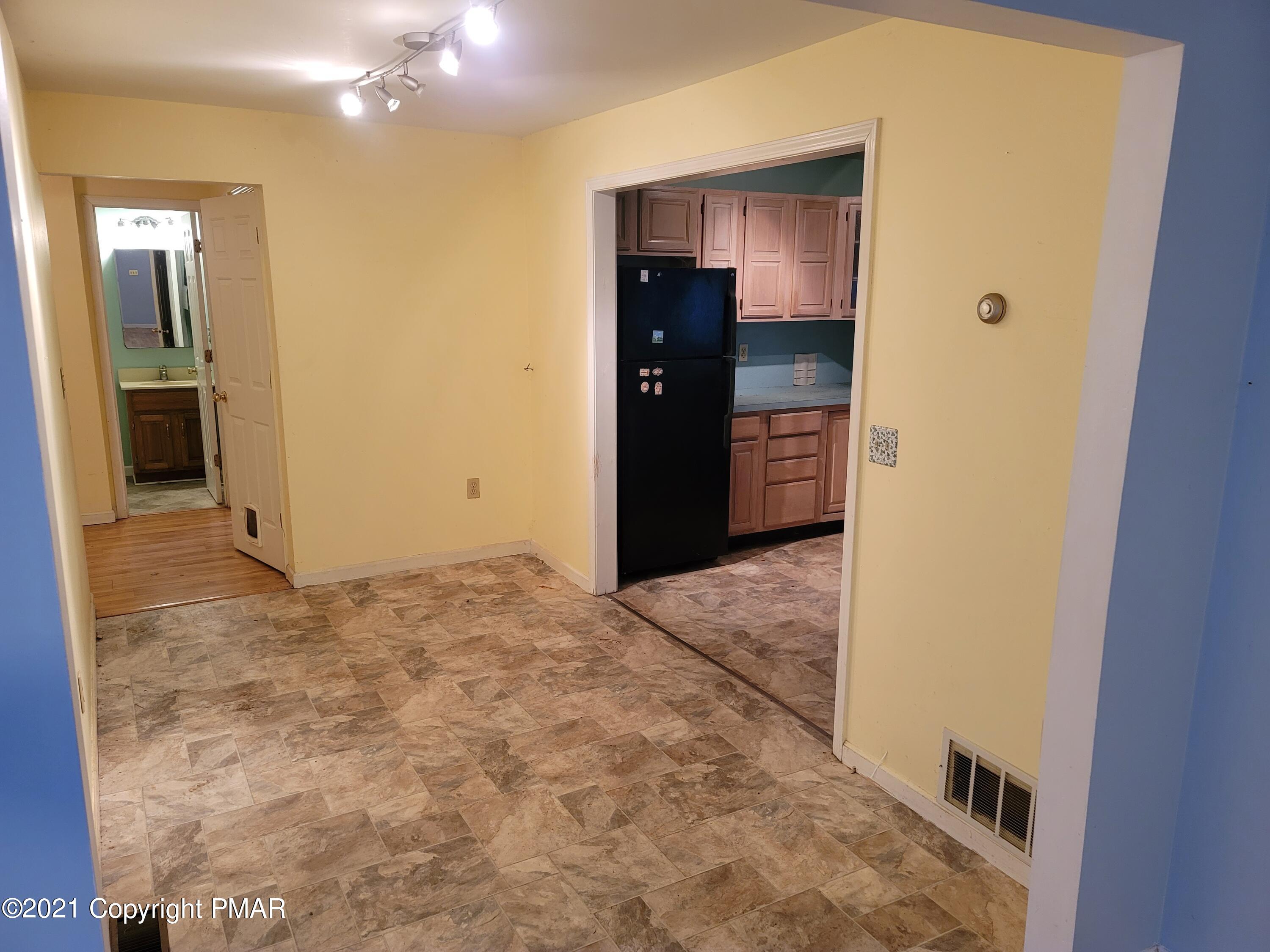 3388 Spruce Cabin Road Cresco, PA 18326 - Photo 9 of 33 view of a hallway with wooden cabinets