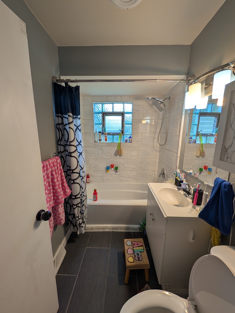 22W425 Arbor Lane Glen Ellyn, IL 60137 - Photo 16 of 18 a bathroom with a sink toilet and shower