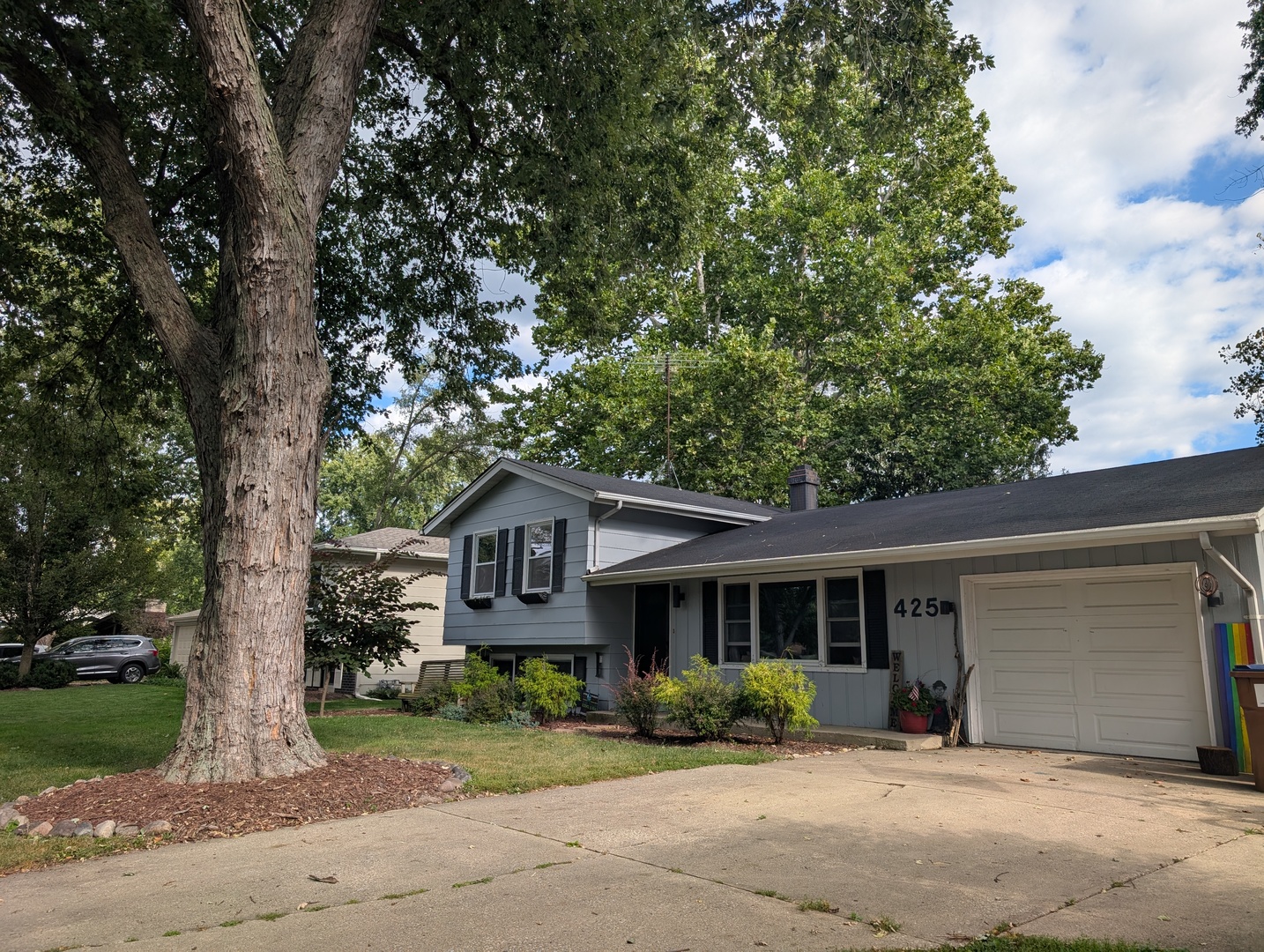 22W425 Arbor Lane Glen Ellyn, IL 60137 - Photo 2 of 18 a front view of a house with a yard and potted plants