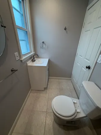 a bathroom with a toilet and a bathtub
