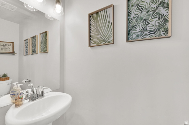2777 West 4175th Street South, Unit 232 Roy, UT 84067 - Photo 8 of 27 Main floor half bathroom