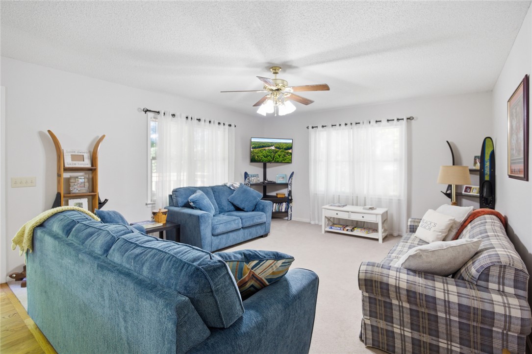 110 Snug Harbor Road Seneca, SC 29678 - Photo 5 of 37 This bright living area features comfortable seating and ample natural light, perfect for relaxation.