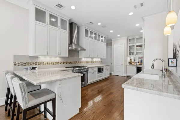 a kitchen with a stove and a sink