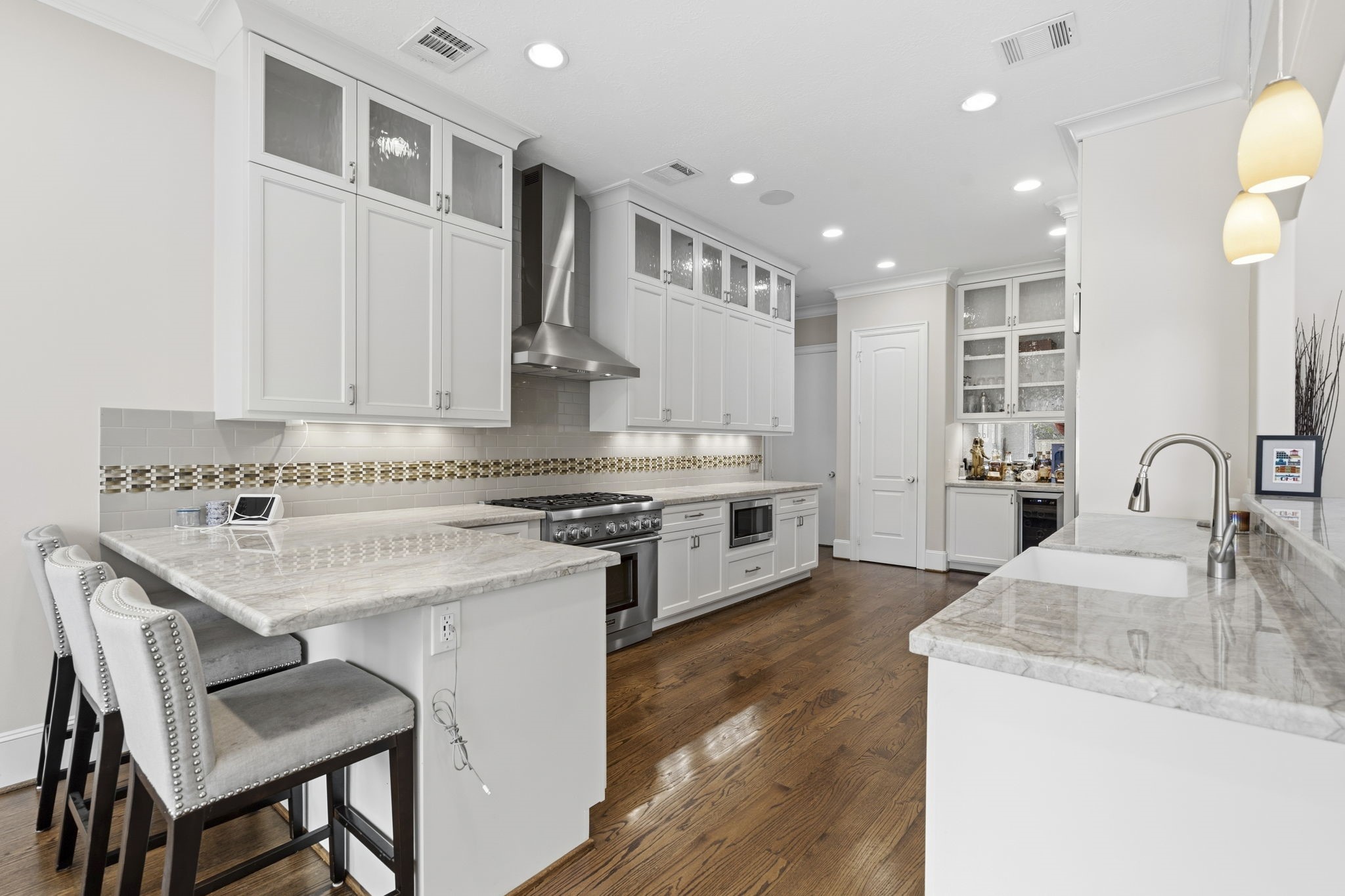 1938 Pech Road Houston, TX 77055 - Photo 11 of 39 a kitchen with a stove and a sink