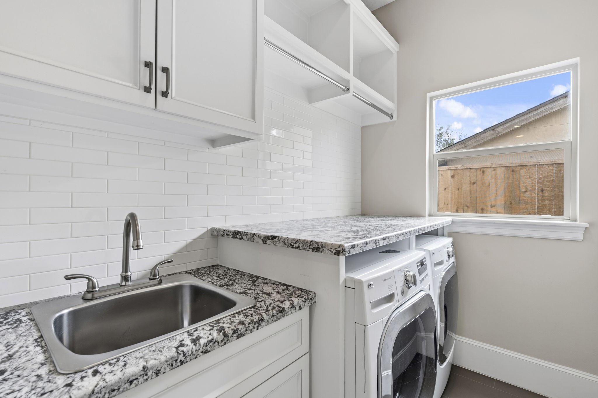 1938 Pech Road Houston, TX 77055 - Photo 18 of 39 a view of utility room and washer dryer