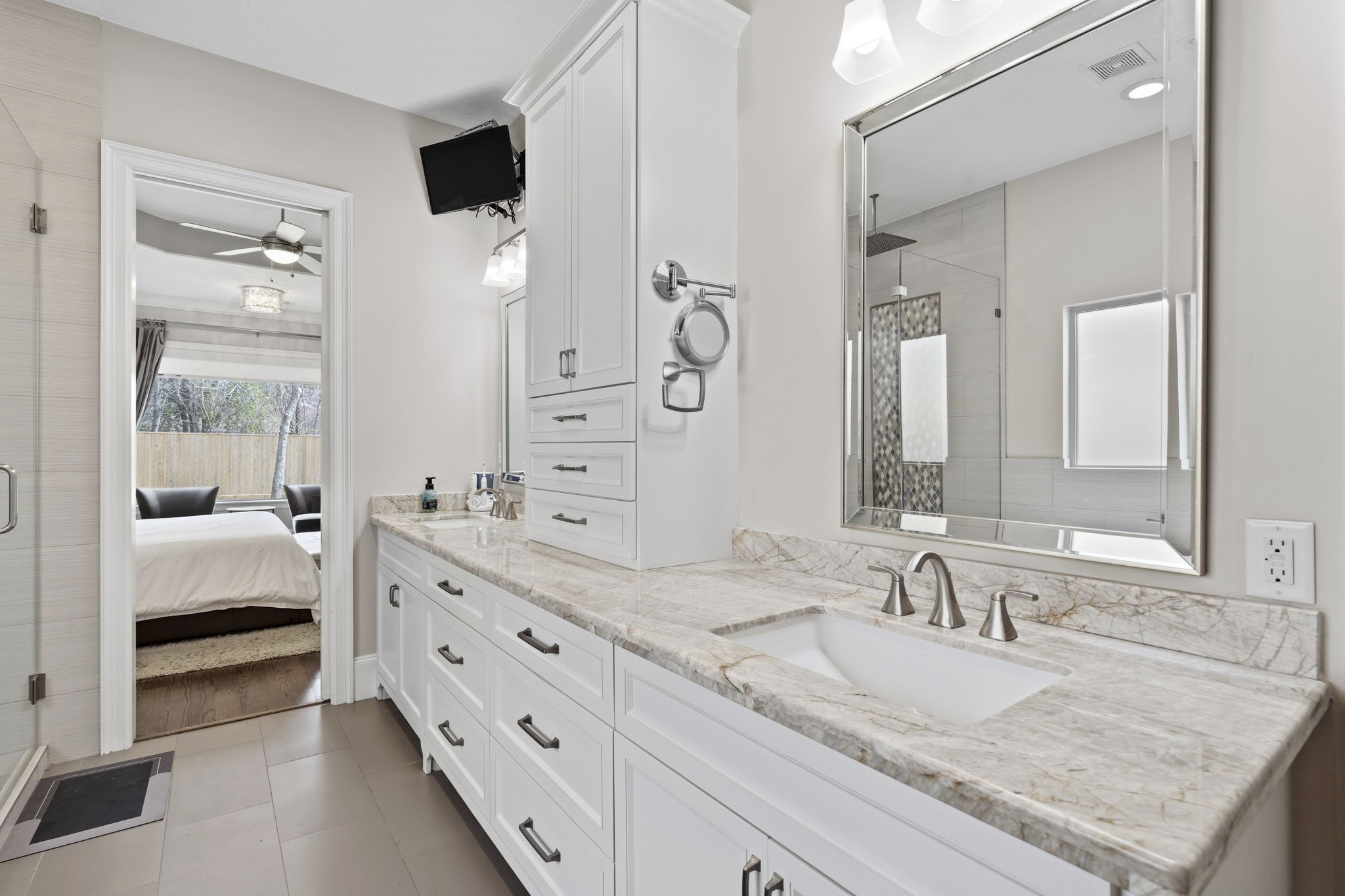 1938 Pech Road Houston, TX 77055 - Photo 23 of 39 a en suite bathroom with a granite countertop sink and a mirror