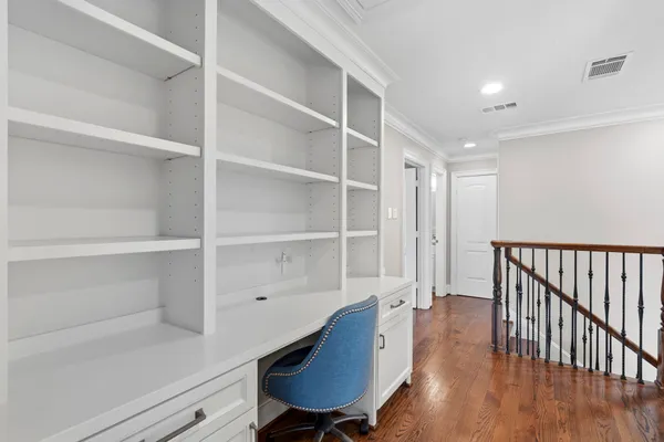 a bathroom with a granite countertop sink a mirror and shower