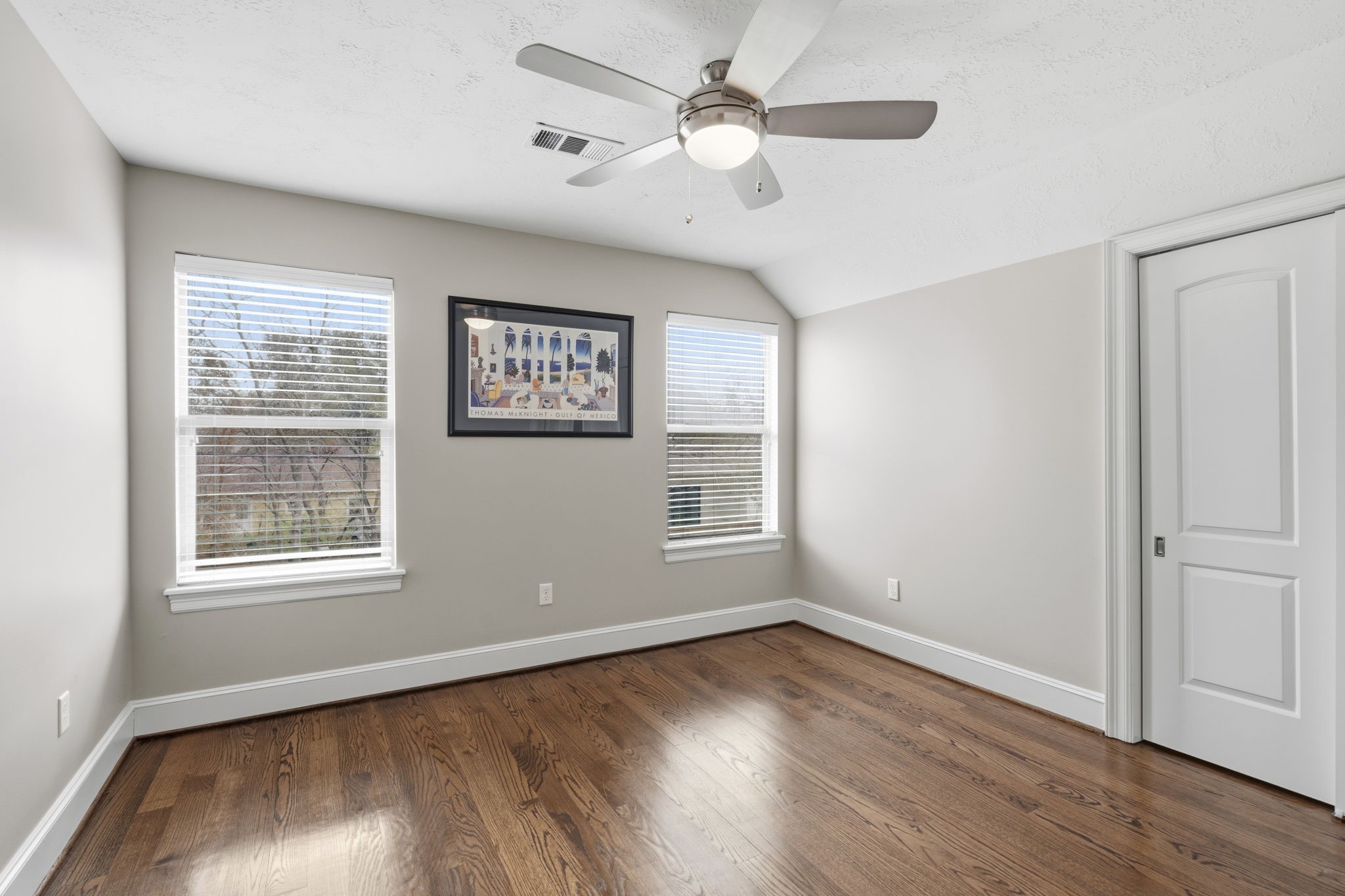 1938 Pech Road Houston, TX 77055 - Photo 29 of 39 a view of an empty room with wooden floor and a window
