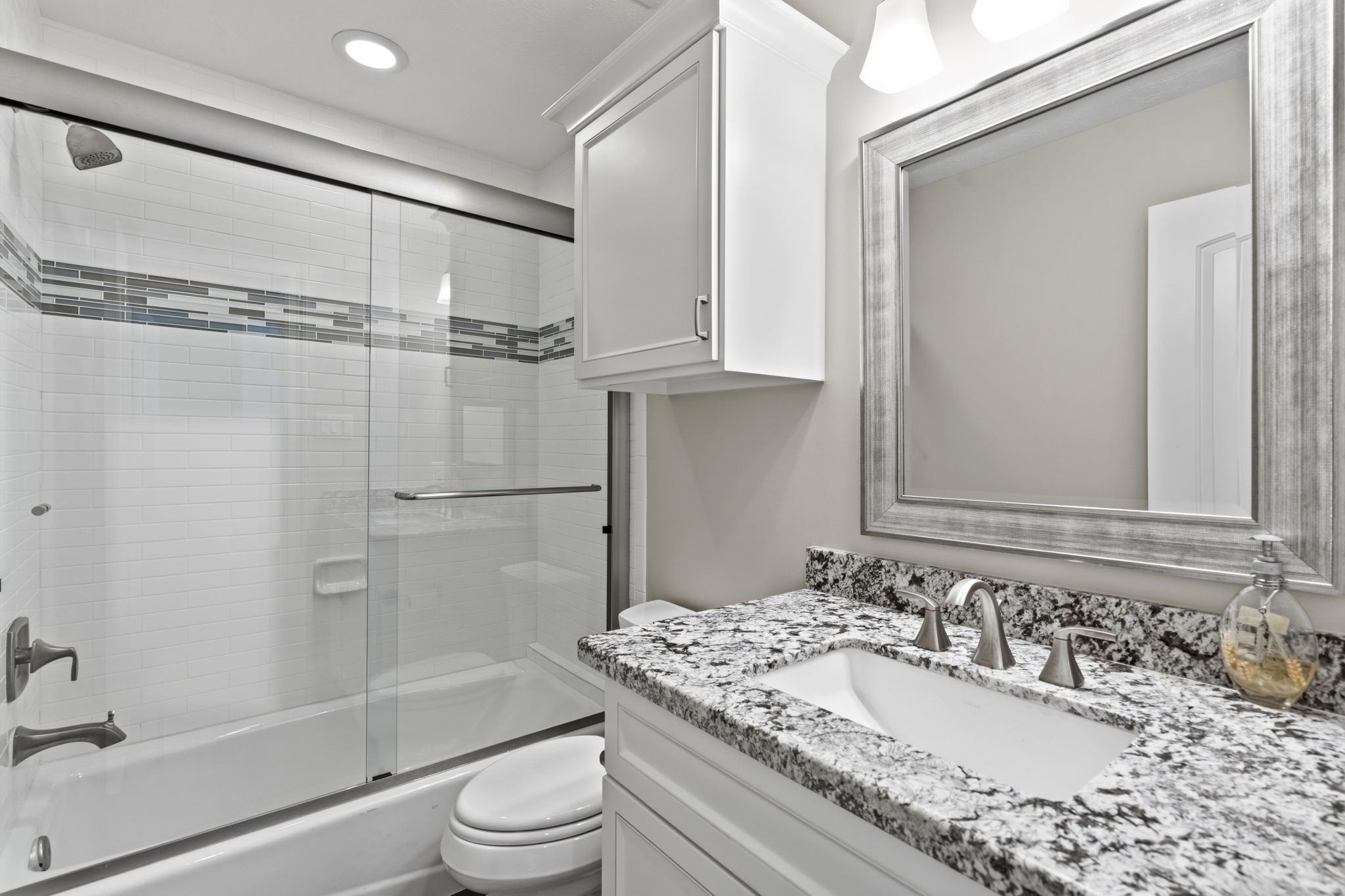 1938 Pech Road Houston, TX 77055 - Photo 33 of 39 a bathroom with a granite countertop sink toilet and shower